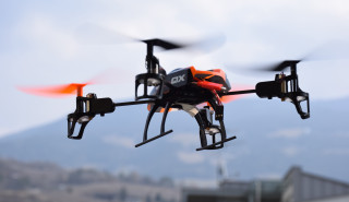 Small black orange flying object - free technology wallpaper