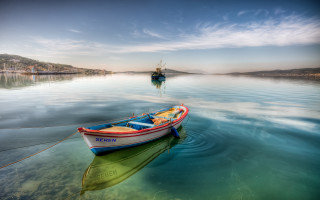 Boat floating lake shoreline distant - top of a lake next free wallpaper