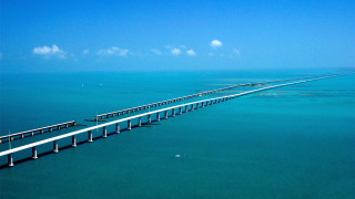 Long bridge spanning ocean blue - the ocean free wallpaper