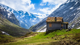 Small cabin mountain range snow - a grassy field below free wallpaper