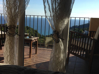 Balcony table chairs ocean view 2 - a balcony free wallpaper