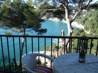 Balcony table chairs water trees - a bottle of wine free wallpaper