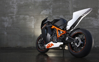 Motorcycle parked wall black orange - a wall free wallpaper