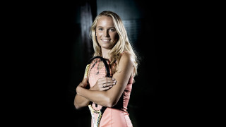 Woman holding tennis racket smiling 2 - a tennis racket free wallpaper
