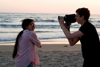 Beach man woman camera video - cinematography free wallpaper