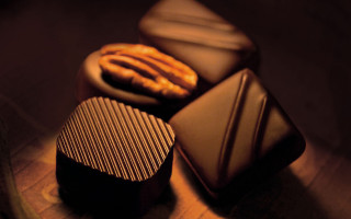 Chocolates cookies still life dark - a close up of a plate free wallpaper