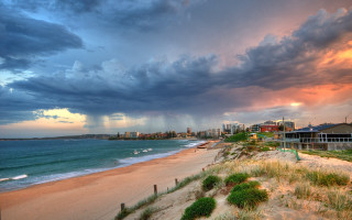 Beach cloudy sky buildings grass - the shore free wallpaper
