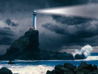 Lighthouse rock light beam ocean - a lighthouse free wallpaper