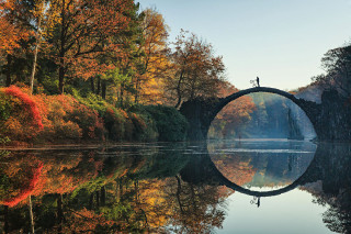 Bridge water trees autumn foliage - a bridge over a body of water free wallpaper