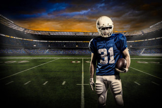 Football player night stadium dramatic - a football player free wallpaper