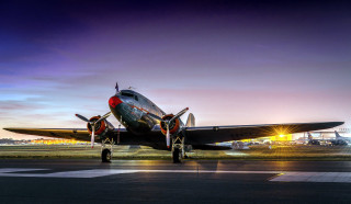 Small airplane runway night time - the sun shining behind free wallpaper