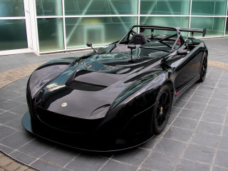 Black sports car brick wall 4 - a large window behind free wallpaper