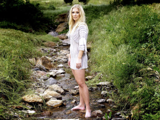 Woman standing stream field grass - free forest wallpaper
