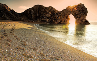 Beach rocks footprints sand water - the rock free wallpaper