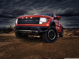 Red truck dirt field cloudy - a black car in the foreground free wallpaper