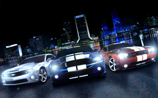 Two cars parked city night - a city skyline in the background free wallpaper