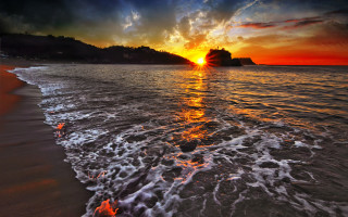 Sunset beach waves mountain clouds 2 - a mountain in the distance free wallpaper