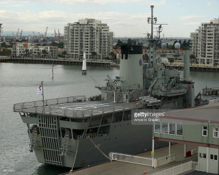 Large ship docked harbor city 2 - tall free wallpaper