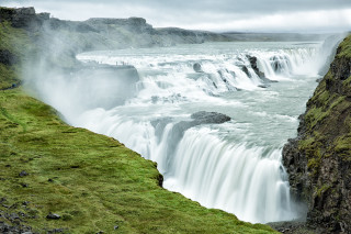 Waterfall middle green field person - a green field below free wallpaper