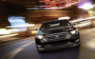 Black car night street blurry 2 - a building in the background free wallpaper