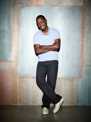 Man standing wall arms crossed - derold page free wallpaper