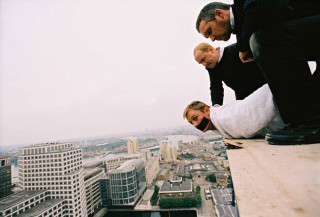 Two men suits cityscape ledged - damien hirst free wallpaper