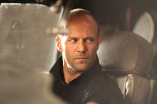 Man sitting car serious look - movie still free wallpaper