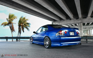 Blue car bridge palm ocean - a palm tree in the background free wallpaper