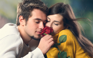 Man woman kissing holding rose 3 - romantic free wallpaper
