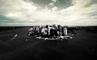 Black white city cloudy sky - a body of water below free wallpaper