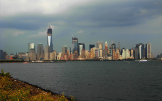 City skyline water cloudy sky 2 - a cloudy sky in the background free wallpaper