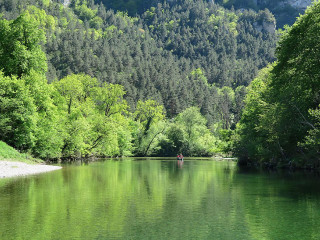 Person boat river trees mountains - alen divi free wallpaper