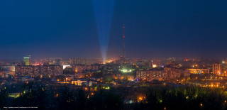 City skyline night light show - overhead in the sky free wallpaper