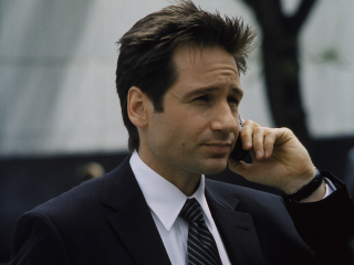 Man suit cellphone talking tie - a tie free wallpaper