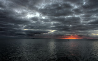 Sunset boat water cloudy sky - a cloudy sky above free wallpaper for desktop