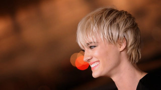 Woman blonde haircut smiling camera - a blurry background free wallpaper