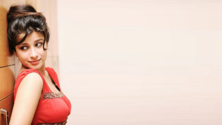 Woman red dress leaning wall 5 - against free wallpaper