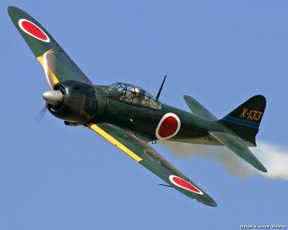 Small green airplane blue sky - the side of it free wallpaper