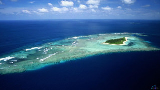 Island ocean small island clouds - a small island in the middle of the ocean free wallpaper
