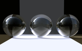 Three shiny balls white surface - a shadow free wallpaper