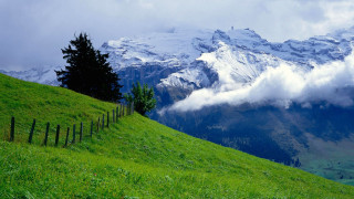 Grassy hill fence mountain clouds 3 - a grassy hill free wallpaper