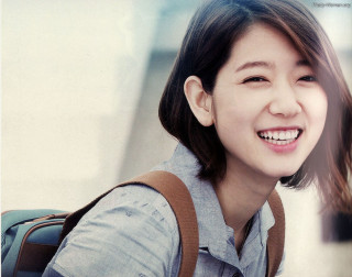 Woman backpack smiles camera waiting - a backpack free wallpaper