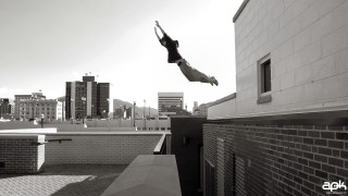 Person jumping skateboard air city - a ledge free wallpaper