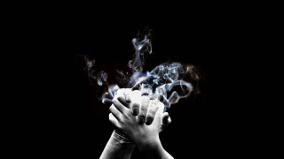 Person hands smoke black background - smoke free wallpaper for desktop