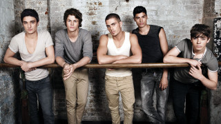 Young men arms crossed brick - a brick wall free wallpaper