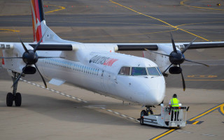 Plane parked runway ladder man - turnaround free wallpaper