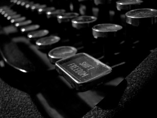 Typewriter closeup buttons book side - shallow free wallpaper for desktop