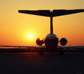 Plane sunset runway orange sky - still free wallpaper