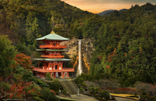 Tall red building waterfall trees 2 - a waterfall in the background and trees free wallpaper
