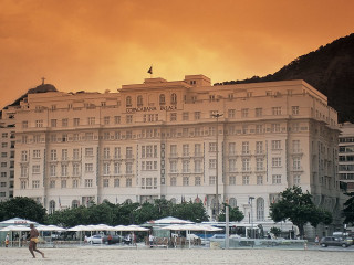 Large building beach umbrellas person - edi rama free wallpaper